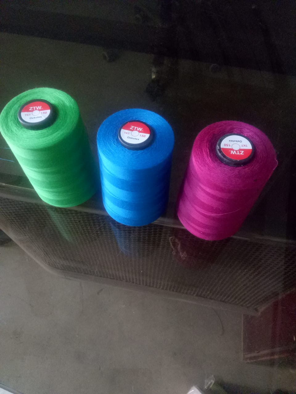 Coloured industrial sewing thread cones
